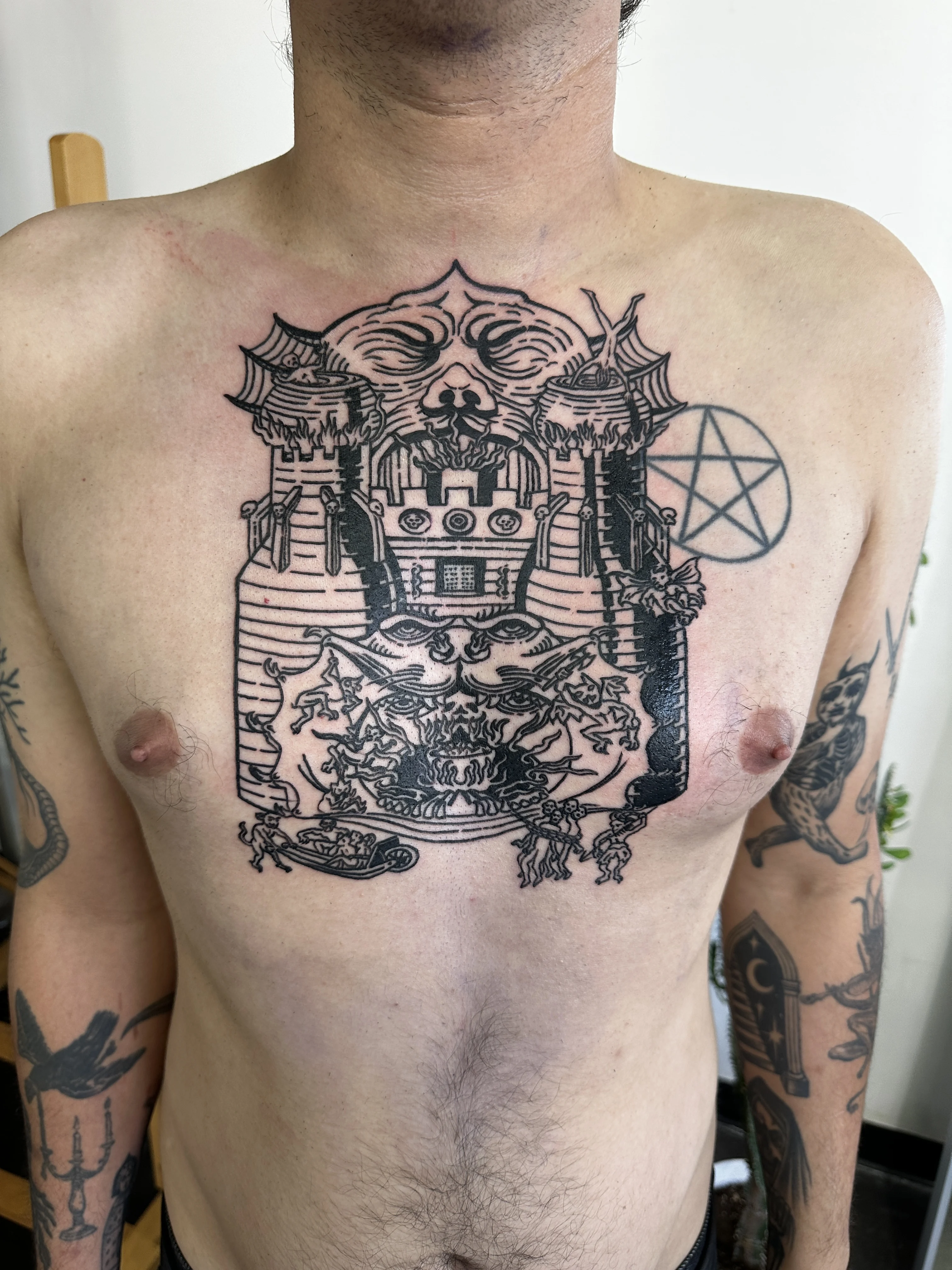 Engraving-style chest tattoo by Mateo Pardo