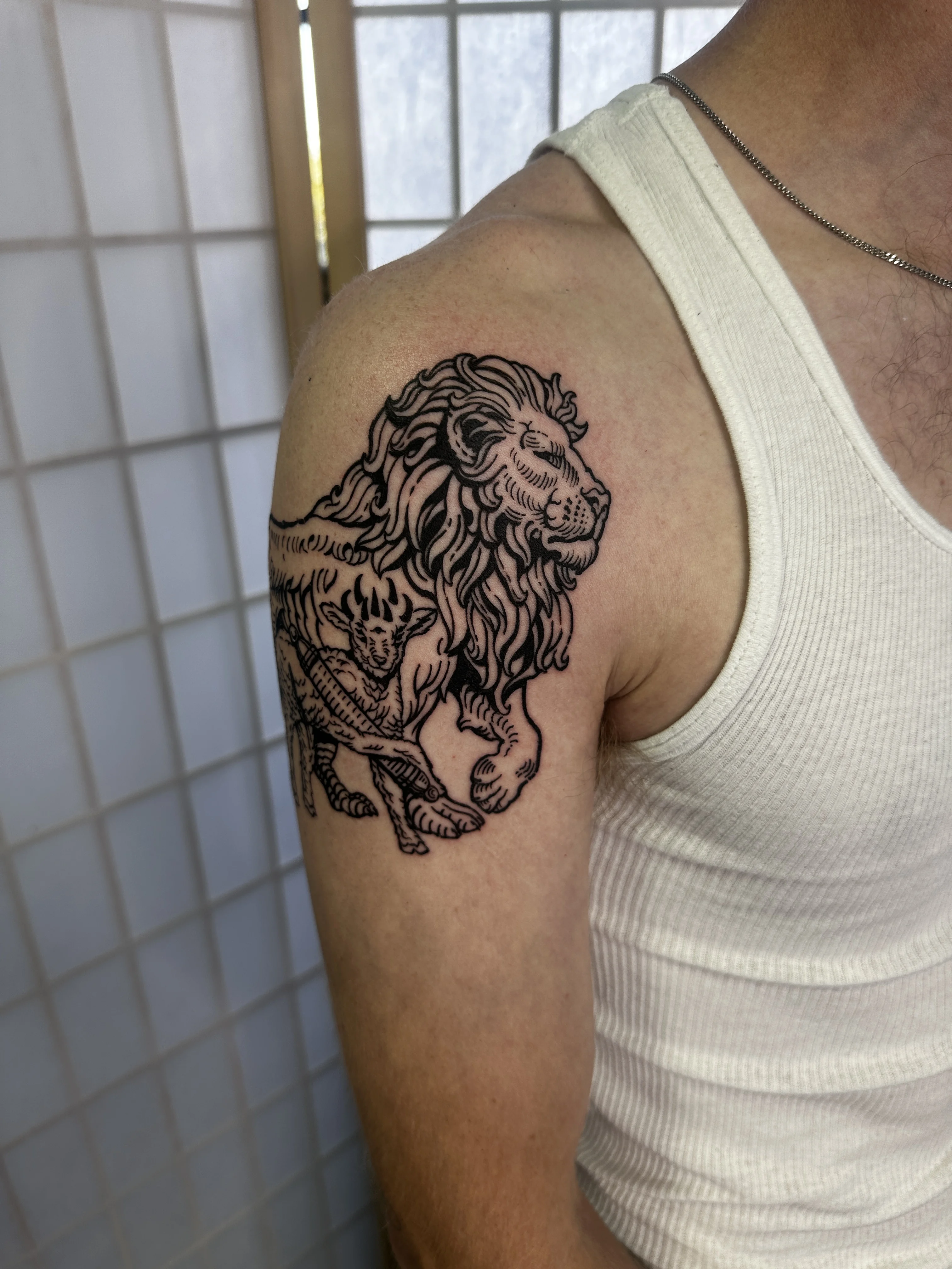 Engraving-style arm tattoo by Mateo Pardo